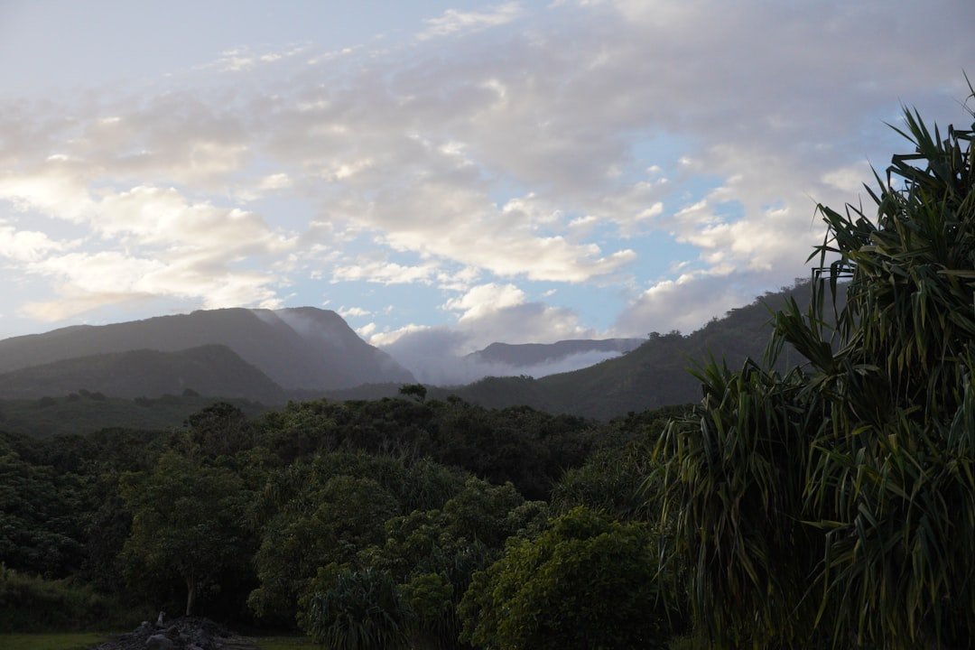 a-view-of-a-mountain-range-with-clouds-in-the-sky-acqeqnzjfys